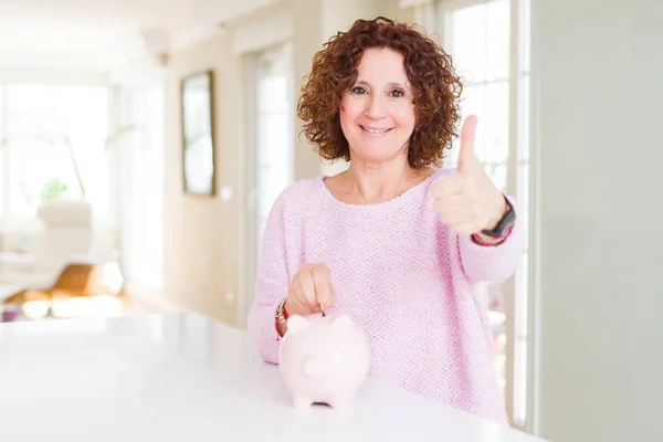 Senior Woman Saving Money Putting Coin Piggy Bank Happy Big — Stock fotografie
