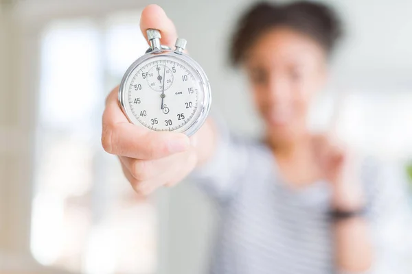 Young African American Woman Holding Stopwatch Surprised Idea Question Pointing — Stock Photo, Image