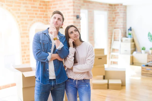 Beautiful Young Couple Moving New House Hand Chin Thinking Question — Stock Photo, Image