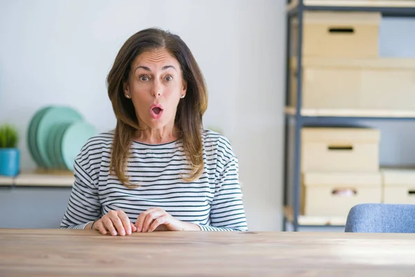 Middle Age Senior Woman Sitting Table Home Shock Face Looking — Stock Photo, Image