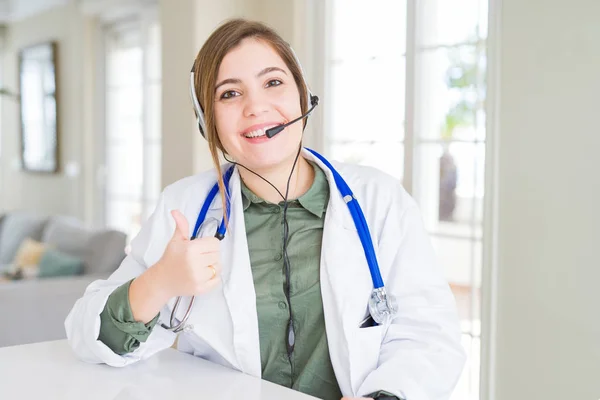 Beautiful Young Doctor Woman Wearing Headset Doing Happy Thumbs Gesture — Stock Photo, Image