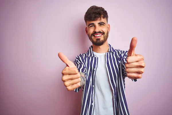 Young Man Tattoo Wearing Striped Shirt Standing Isolated Pink Background — Stock Photo, Image