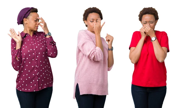 非洲裔美国妇女与非洲头发在孤立的背景嗅到的东西臭气熏天 无法忍受的气味 屏住呼吸与手指在鼻子 难闻的气味概念 — 图库照片