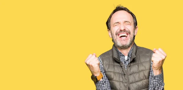 Middle Age Handsome Man Wearing Winter Vest Celebrating Surprised Amazed — Stock Photo, Image