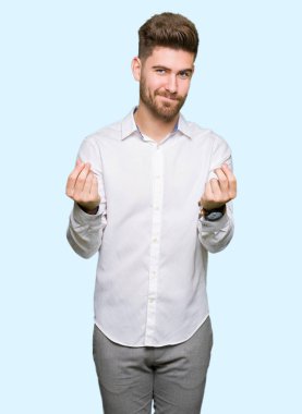 Genç yakışıklı iş adamı yapıyor para jest maaş ödeme için milyoner iş isteyen el ile