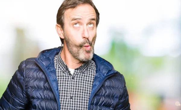 Middle Age Handsome Man Wearing Winter Coat Making Fish Face — Stock Photo, Image