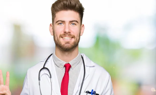 Joven Médico Guapo Hombre Con Abrigo Médico Mostrando Señalando Hacia —  Fotos de Stock