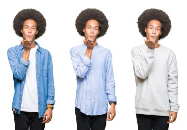 Beyaz izole arka plan üzerinde afro saç ile genç adam kolaj güzel ve seksi olmak hava el ile bir öpücük üfleme kamera bakıyor. Aşk ifadesi.