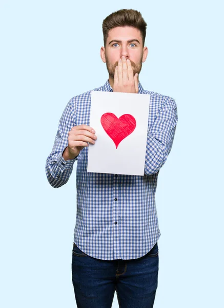 Young Handsome Man Holding Paper Red Heart Cover Mouth Hand — Stock Photo, Image