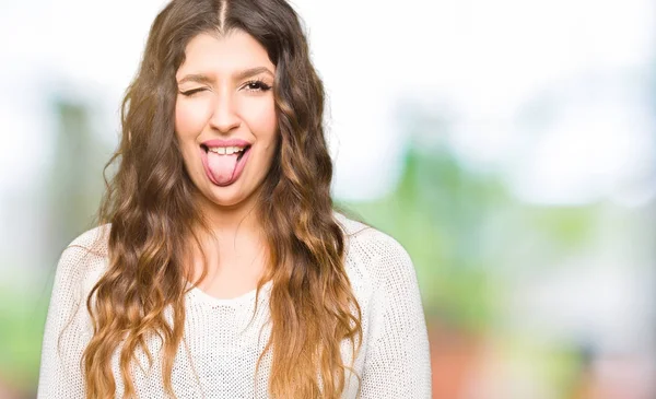 Mujer Hermosa Joven Con Suéter Blanco Sacando Lengua Feliz Con —  Fotos de Stock