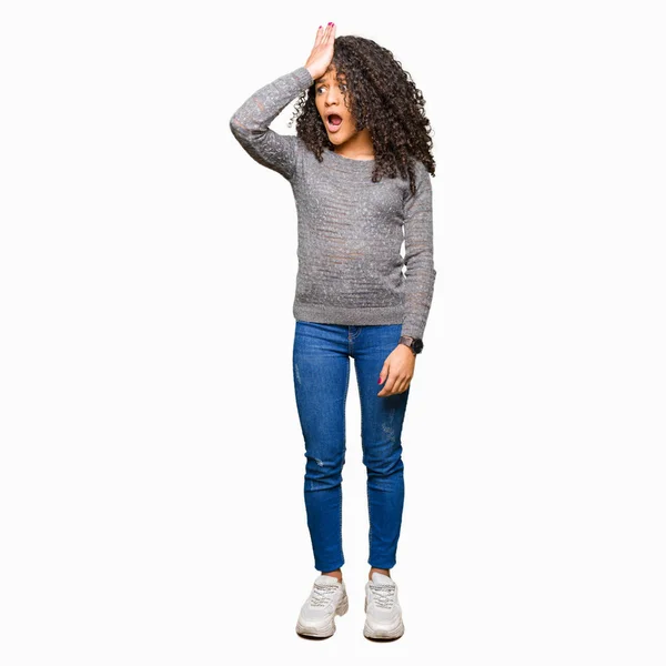 Young Beautiful Woman Curly Hair Wearing Grey Sweater Surprised Hand — Stock Photo, Image