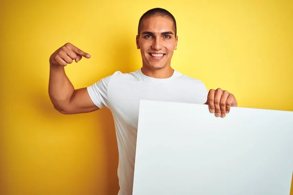 Young Handsome Man Holding Advertising Banner Yellow Isolated Background Surprise — Stock Photo, Image