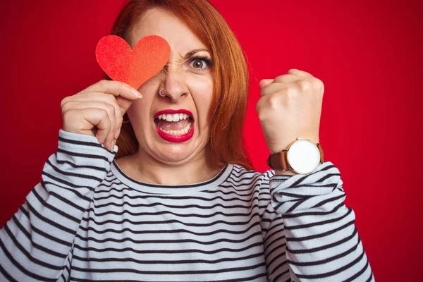 Young Redhead Romantic Woman Holding Heart Red Isolated Background Annoyed — Stock Photo, Image