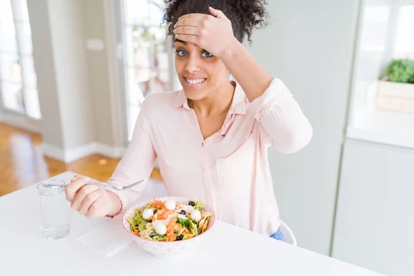 Young African American Woman Eating Healthy Pasta Salad Stressed Hand — Stock Photo, Image