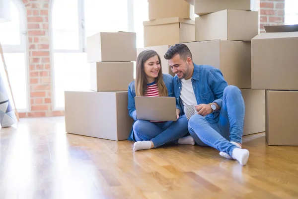 Young Couple Sitting Floor Cardboard Boxes Using Computer Laptop Very — Stock Photo, Image