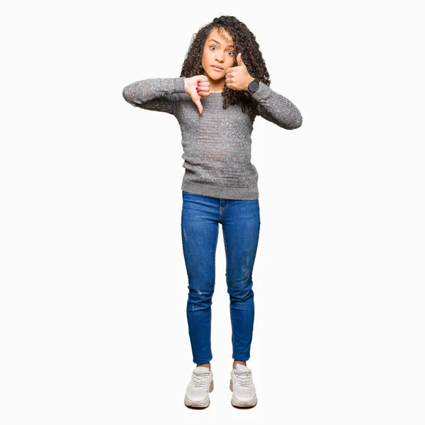 Young Beautiful Woman Curly Hair Wearing Grey Sweater Doing Thumbs — Stock Photo, Image