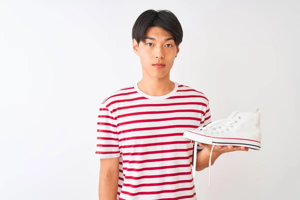 Handsome Chinese Man Holding Casual Sneakers Standing Isolated White Background — Stock Photo, Image