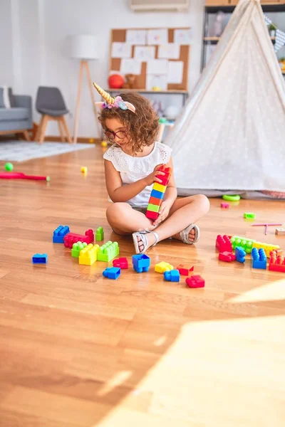 Beautiful Toddler Wearing Glasses Unicorn Diadem Sitting Playing Building Blocks — Stock Photo, Image