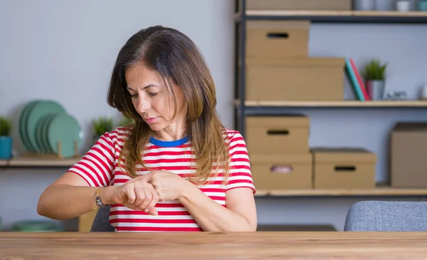 Middle Age Senior Woman Sitting Table Home Checking Time Wrist — Stock Photo, Image