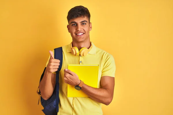 Indian Student Man Wearing Backpack Headphones Notebook Isolated Yellow Background — Stock Photo, Image