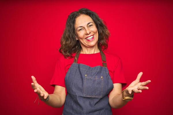 Middle Age Senior Woman Wearing Apron Uniform Red Isolated Background — Stock Photo, Image