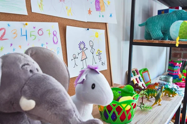 Beautiful games corner with lots of toys and draws at kindergarten