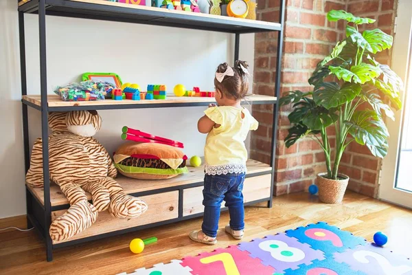 Beautiful Toddler Standing Taking Toys Shelving Kindergarten — Stock Photo, Image
