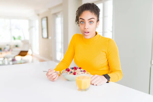 Young African American Girl Eating Healthy Cereals Breakfast Scared Shock — Stock Photo, Image