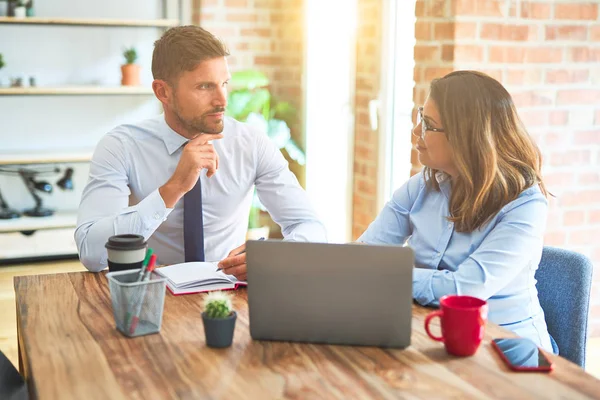 Young business team of woman and man working together at the office