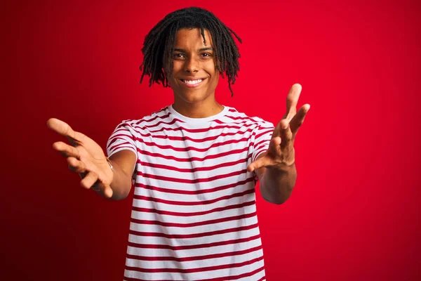 Young Afro Man Dreadlocks Wearing Striped Shirt Standing Isolated Red — Stock Photo, Image