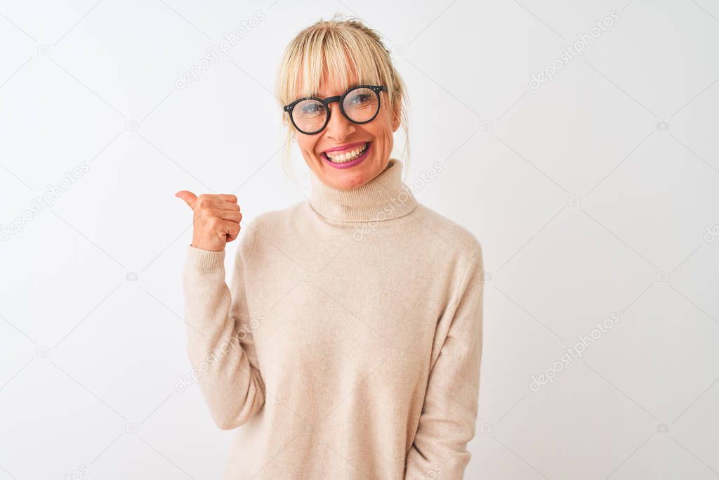 Middle age woman wearing turtleneck sweater and glasses over isolated white background smiling with happy face looking and pointing to the side with thumb up.