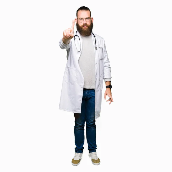 Young Blond Doctor Man Beard Wearing Medical Coat Pointing Finger — Stock Photo, Image