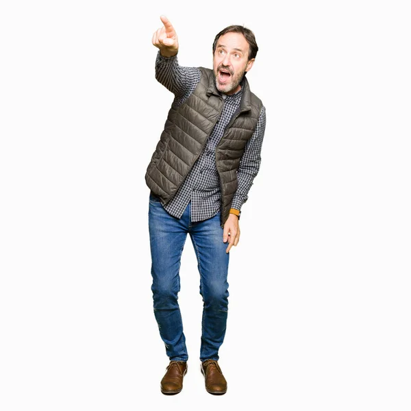 Middle Age Handsome Man Wearing Winter Vest Pointing Finger Surprised — Stock Photo, Image