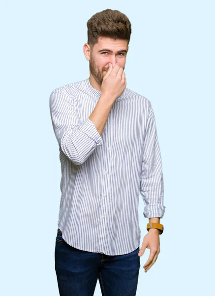 Young Handsome Man Smelling Something Stinky Disgusting Intolerable Smell Holding — Stock Photo, Image