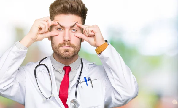 Young Handsome Doctor Man Wearing Medical Coat Trying Open Eyes — Stock Photo, Image