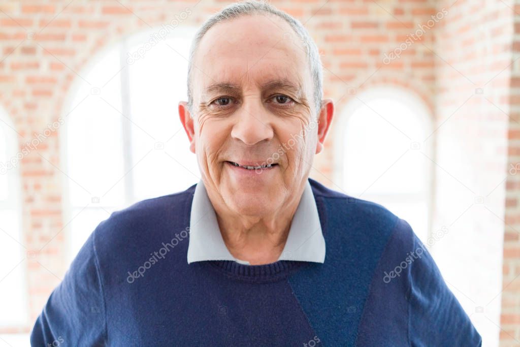 Handsome middle age senior man smiling cheerful, happy and posit