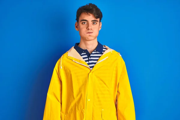 Teenager Fisherman Boy Wearing Yellow Raincoat Isolated Background Puffing  Cheeks Stock Photo by ©Krakenimages.com 312191788
