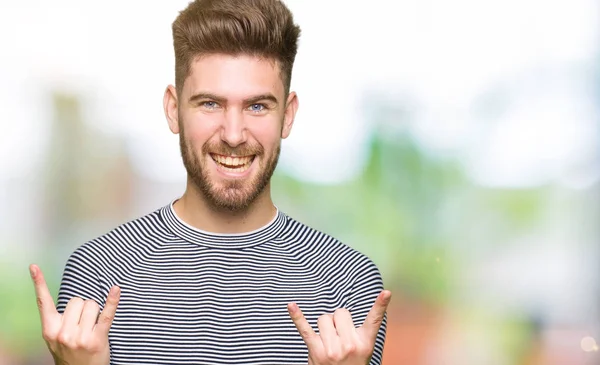 Young Handsome Man Wearing Stripes Sweater Shouting Crazy Expression Doing — Stock Photo, Image