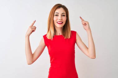 Redhead businesswoman wearing elegant red dress standing over isolated white background smiling pointing to head with both hands finger, great idea or thought, good memory