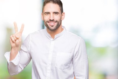 Genç iş adamı gösterilen ve parmakları ile işaret izole arka plan üzerinde ikincisi ise kendinden emin ve mutlu gülümseyerek.