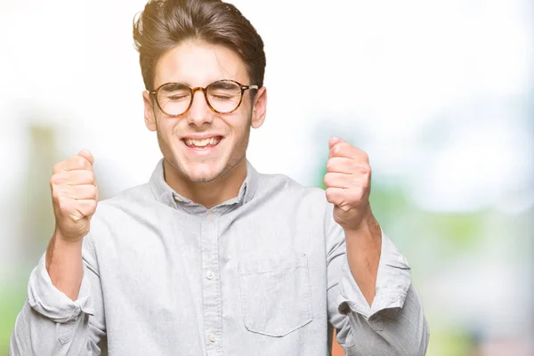 Homem Bonito Jovem Usando Óculos Sobre Fundo Isolado Animado Para — Fotografia de Stock