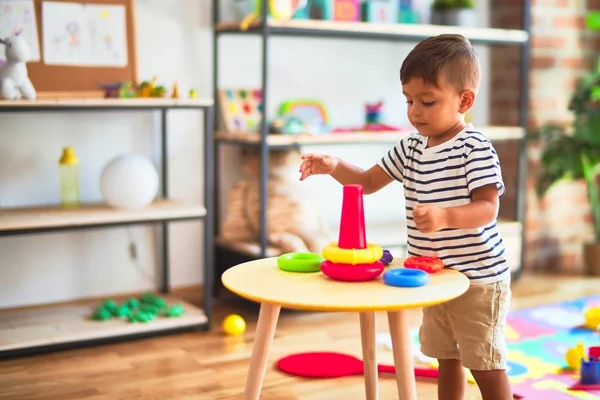 Beautiful Toddler Boy Building Pyramid Hoops Bolcks Kindergarten — Stock Photo, Image