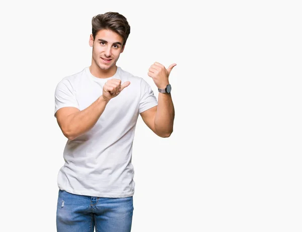 Jovem Homem Bonito Vestindo Camiseta Branca Sobre Fundo Isolado Apontando — Fotografia de Stock