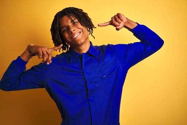 Afro Worker Man Dreadlocks Wearing Mechanic Uniform Isolated Yellow Background — Stock Photo, Image