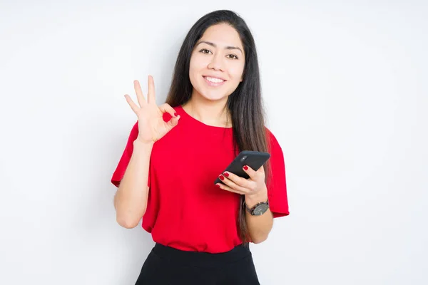 Young Brunette Woman Using Smartphone Isolated Background Doing Sign Fingers — Stock Photo, Image