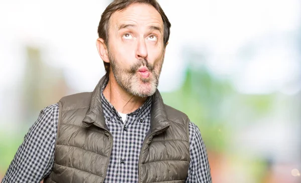 Middle Age Handsome Man Wearing Winter Vest Making Fish Face — Stock Photo, Image