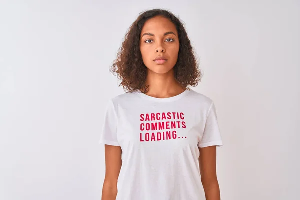 Brazilian woman wearing fanny t-shirt with irony comments over isolated white background with a confident expression on smart face thinking serious