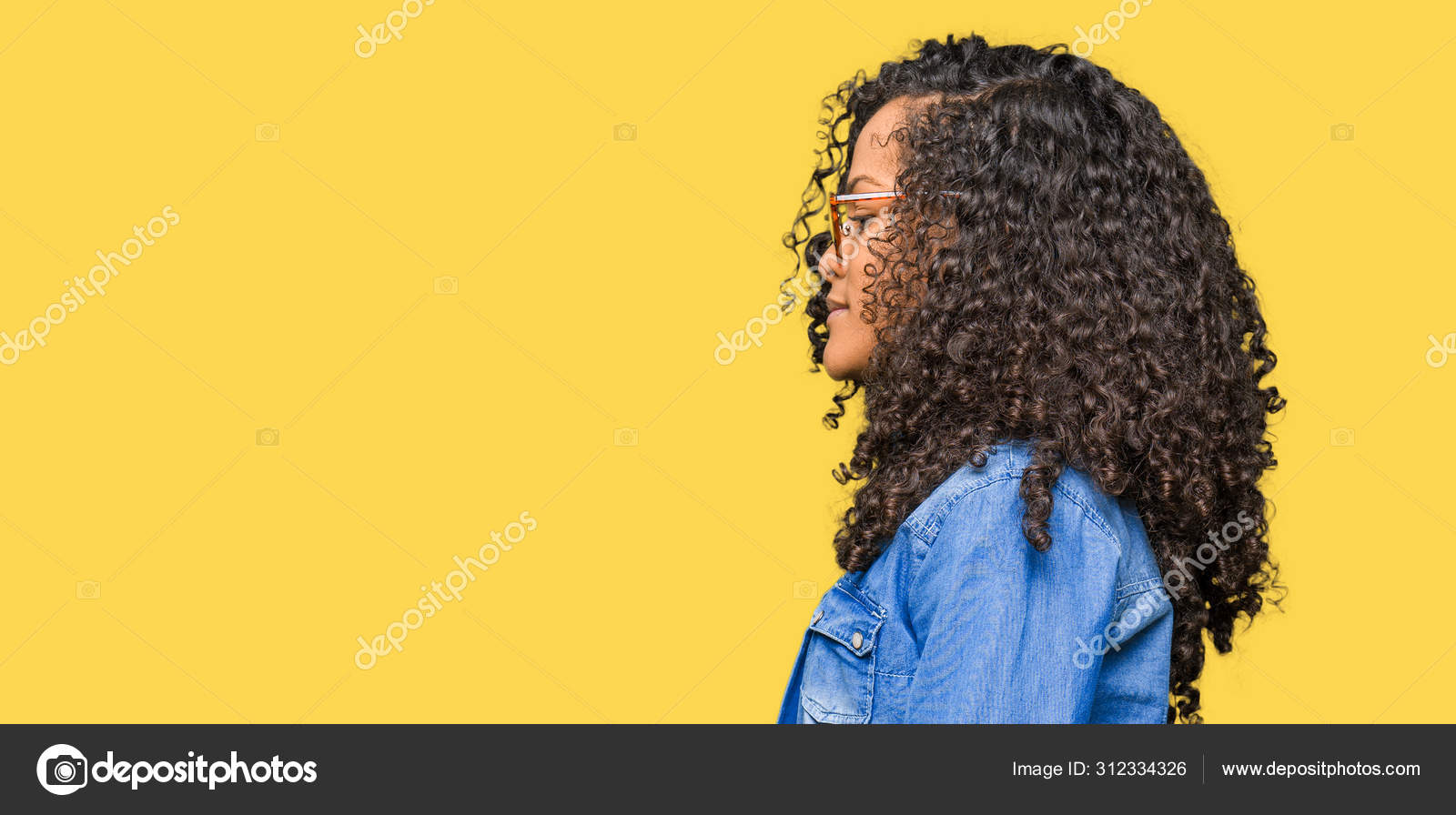 Young Beautiful Woman Curly Hair Wearing Glasses Looking Side