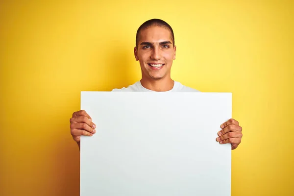 Young Handsome Man Holding Advertising Banner Yellow Isolated Background Happy — ストック写真