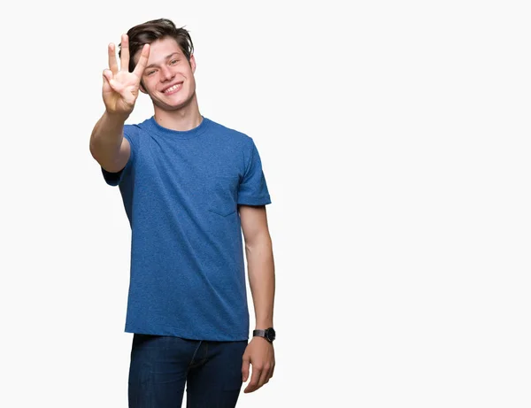 Mladý Pohledný Muž Nosí Modré Tričko Izolované Pozadí Zobrazení Ukázal — Stock fotografie